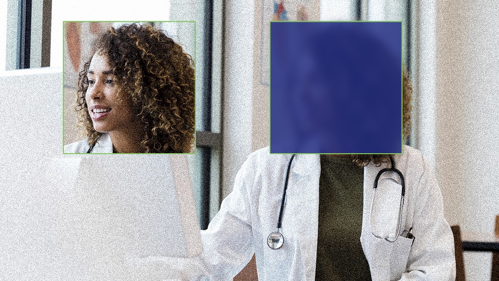 doctor sitting at a computer